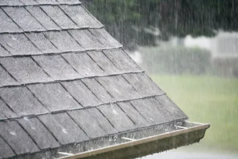 rain on shingle roof during seasons
